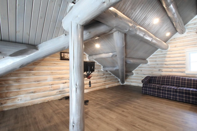 additional living space featuring wooden ceiling, lofted ceiling with beams, wood finished floors, and log walls