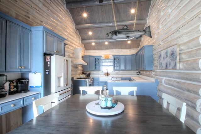 dining space featuring beam ceiling, high vaulted ceiling, and wood ceiling