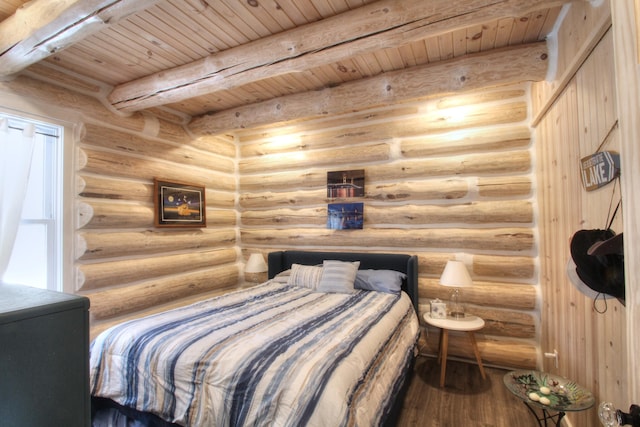 bedroom with wood finished floors, rustic walls, beamed ceiling, and wooden ceiling