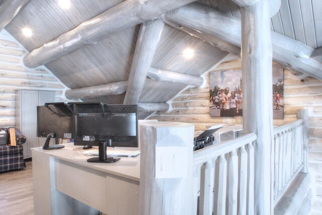 home office with rustic walls, wood finished floors, vaulted ceiling with beams, and wood ceiling