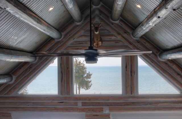 interior details with beam ceiling, wooden ceiling, and a water view