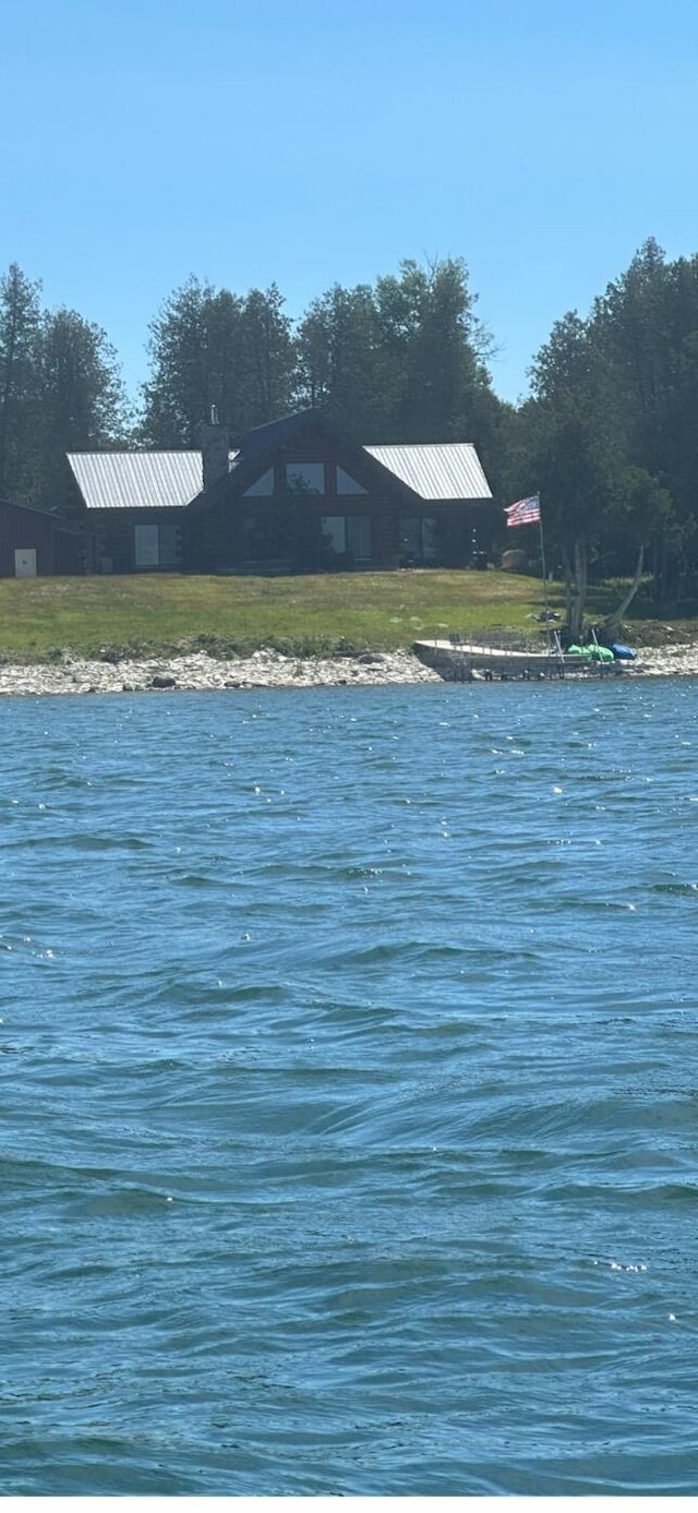 exterior space with a water view