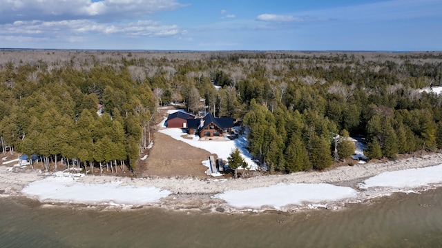 birds eye view of property featuring a view of trees