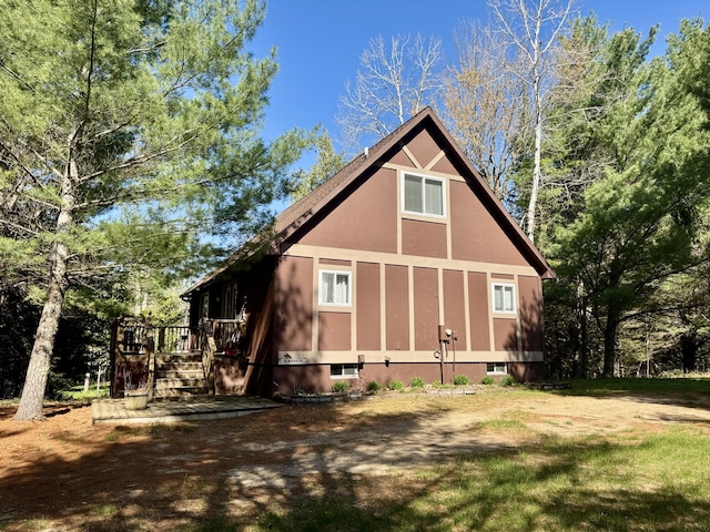 2330 Kirkland Dr, Grayling, MI 49738 - rear view of house featuring a deck and stucco siding