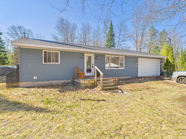 ranch-style home featuring a front yard and an attached garage