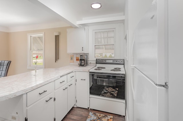 kitchen featuring dark wood-style floors, white cabinets, white appliances, and light countertops