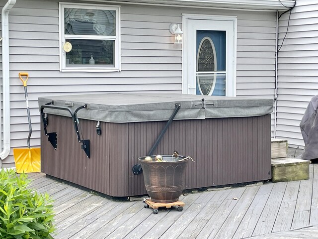 deck featuring a hot tub