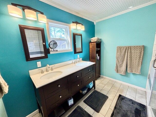 full bathroom featuring double vanity, baseboards, a sink, and ornamental molding