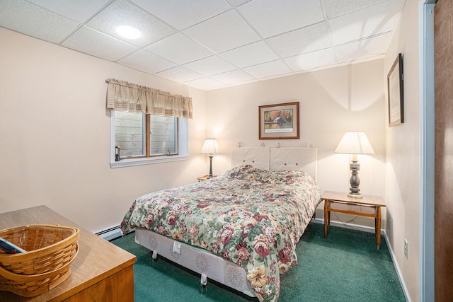 carpeted bedroom featuring baseboards, a paneled ceiling, and baseboard heating