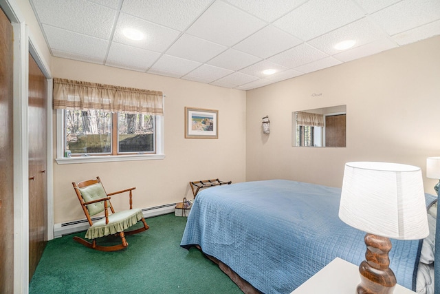 bedroom with recessed lighting, carpet flooring, a paneled ceiling, and a baseboard heating unit