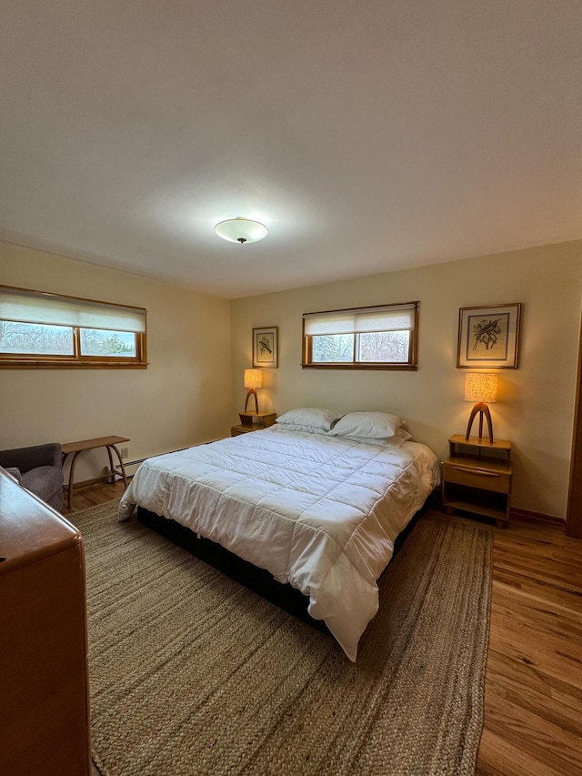 bedroom featuring wood finished floors