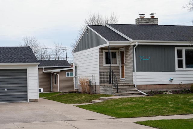 ranch-style home featuring a shingled roof, a front lawn, a garage, a chimney, and concrete driveway