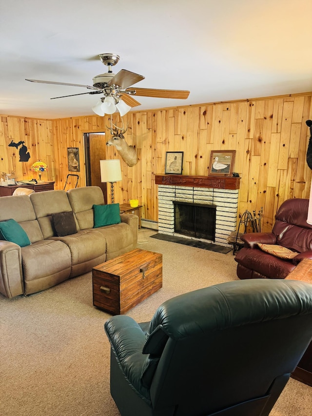 17745 Shubert Hwy, Alpena, MI 49707 - carpeted living room featuring wood walls, a baseboard heating unit, a ceiling fan, and a fireplace