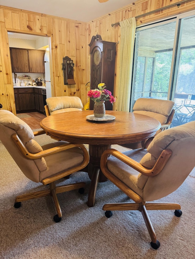 17745 Shubert Hwy, Alpena, MI 49707 - dining space with light carpet and wood walls