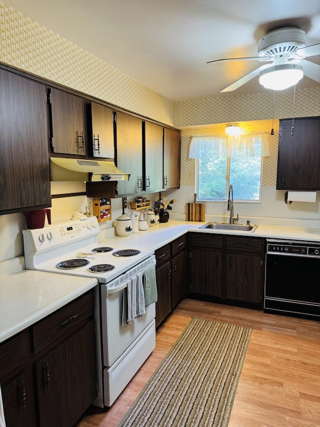 17745 Shubert Hwy, Alpena, MI 49707 - kitchen featuring black dishwasher, white electric range, under cabinet range hood, wallpapered walls, and a ceiling fan