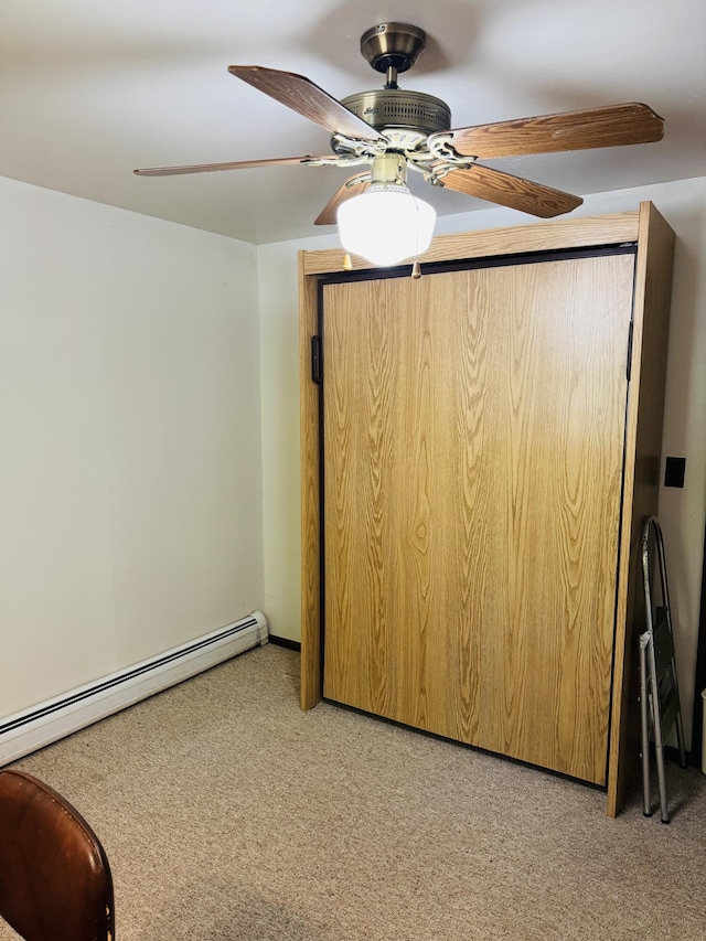 17745 Shubert Hwy, Alpena, MI 49707 - unfurnished room with light colored carpet, a ceiling fan, and baseboard heating