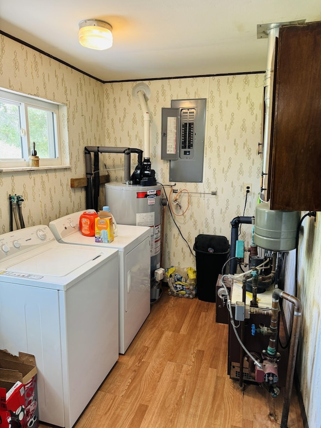 17745 Shubert Hwy, Alpena, MI 49707 - laundry room featuring washing machine and dryer, electric panel, light wood-style floors, wallpapered walls, and gas water heater