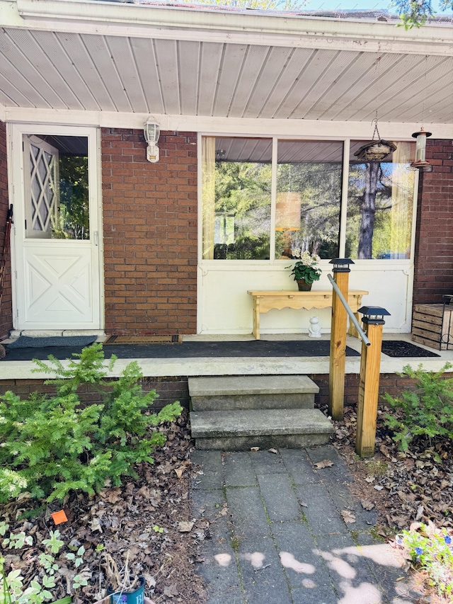 17745 Shubert Hwy, Alpena, MI 49707 - view of exterior entry featuring brick siding