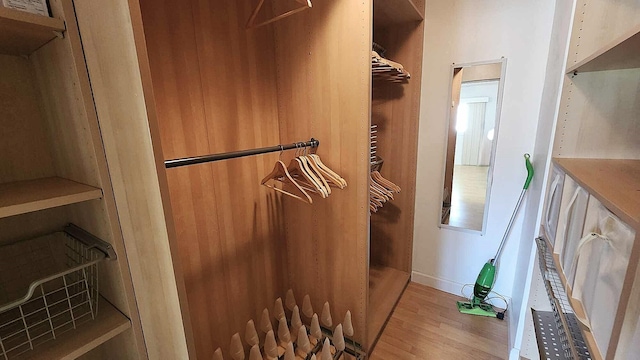 spacious closet featuring wood finished floors