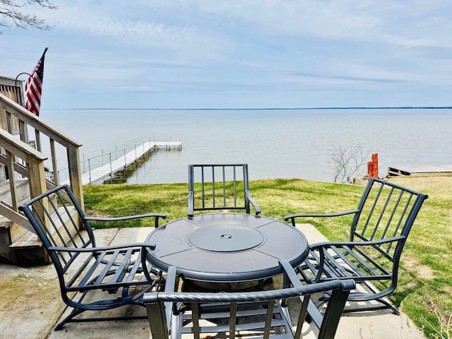 1106 Houghton View Dr, Houghton Lake, MI 48629 - view of patio / terrace with a water view and outdoor dining area