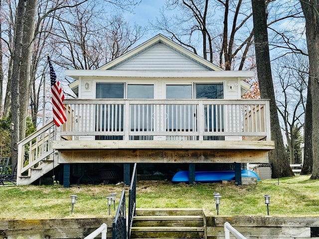 1106 Houghton View Dr, Houghton Lake, MI 48629 - rear view of house featuring a deck, stairs, and a yard