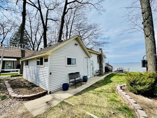 1106 Houghton View Dr, Houghton Lake, MI 48629 - view of home's exterior featuring a yard