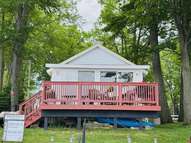 1106 Houghton View Dr, Houghton Lake, MI 48629 - rear view of property with a deck