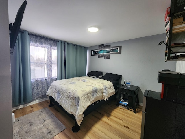 bedroom with light wood-type flooring