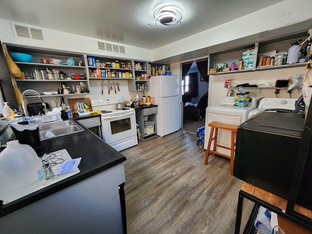 kitchen featuring a sink, visible vents, open shelves, and white appliances