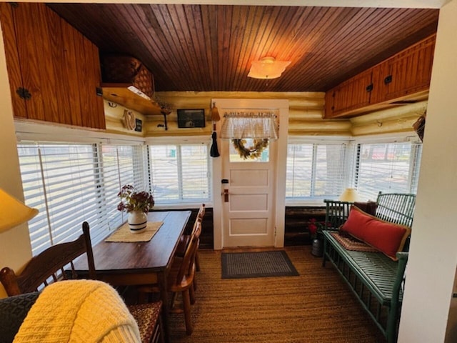 dining area featuring wood ceiling