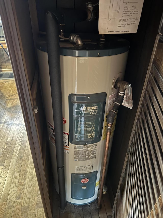 utility room featuring water heater
