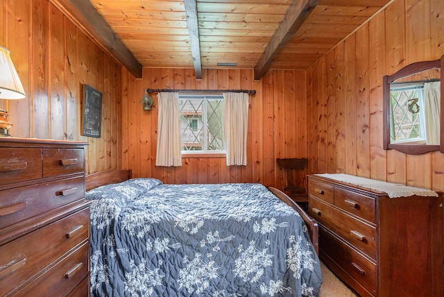 bedroom with wooden walls, wooden ceiling, beamed ceiling, and carpet