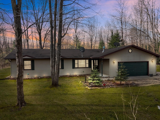 321 Greenleaf Dr, Houghton Lake, MI 48629 - view of front facade featuring an attached garage, concrete driveway, and a front yard