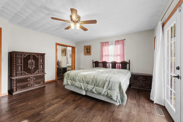 321 Greenleaf Dr, Houghton Lake, MI 48629 - bedroom featuring visible vents, a closet, wood finished floors, baseboards, and ceiling fan