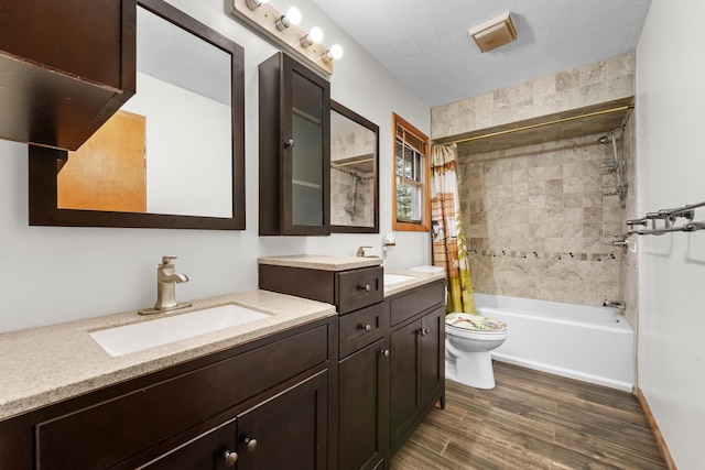 321 Greenleaf Dr, Houghton Lake, MI 48629 - full bathroom with vanity, toilet, shower / bathtub combination with curtain, and wood finished floors