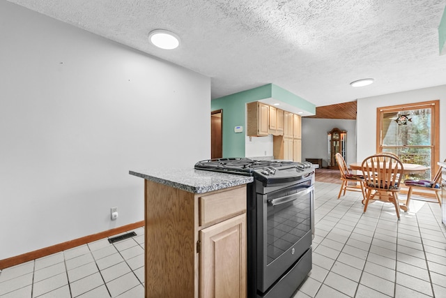 321 Greenleaf Dr, Houghton Lake, MI 48629 - kitchen featuring visible vents, light brown cabinetry, gas stove, baseboards, and light tile patterned flooring