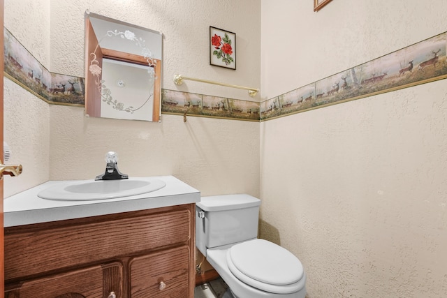 321 Greenleaf Dr, Houghton Lake, MI 48629 - half bath featuring vanity, a textured wall, and toilet