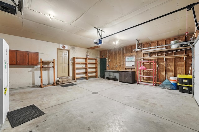 321 Greenleaf Dr, Houghton Lake, MI 48629 - garage with a garage door opener