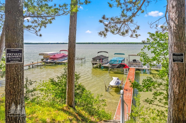 2931 Boulan Dr, Lewiston, MI 49756 - view of dock featuring a water view and boat lift