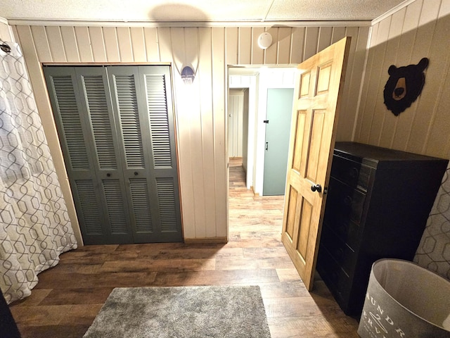 interior space with wood walls and light wood-type flooring
