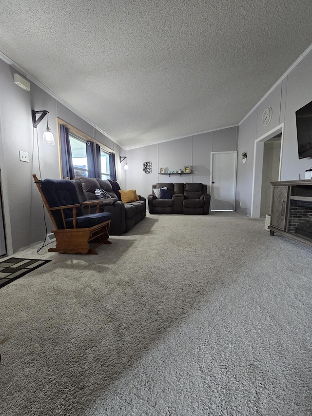 carpeted living room with a textured ceiling and ornamental molding