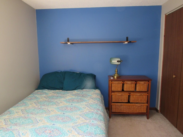 bedroom featuring light carpet