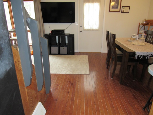 dining area with a healthy amount of sunlight, baseboards, and wood-type flooring