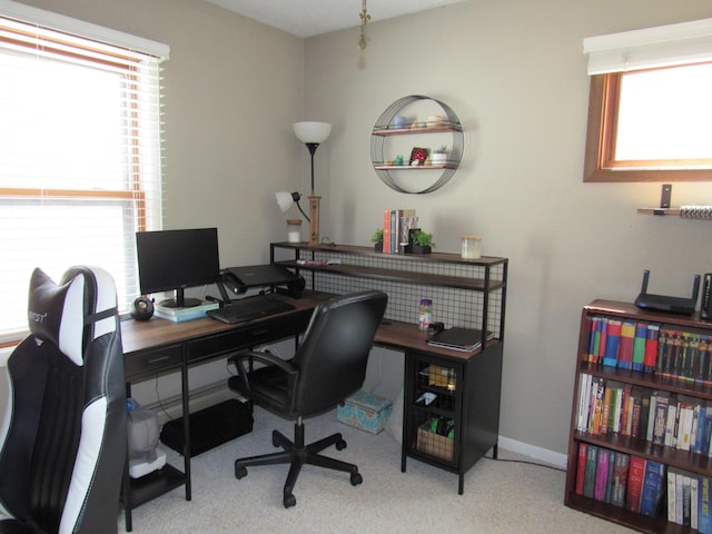 carpeted office with baseboards