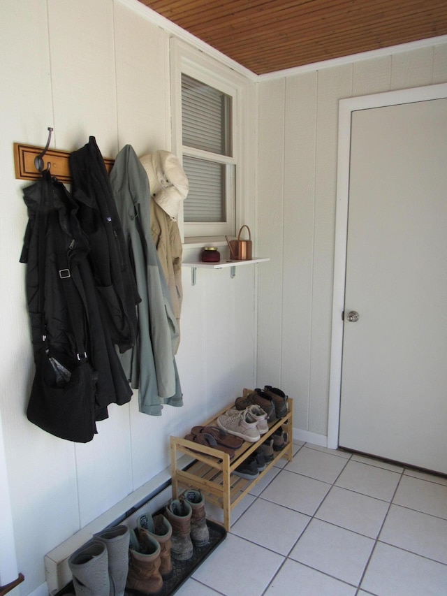 mudroom featuring light tile patterned flooring and wooden ceiling