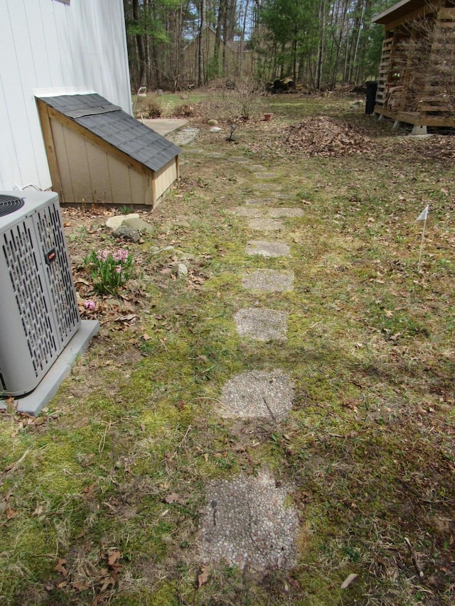 view of yard with central AC unit