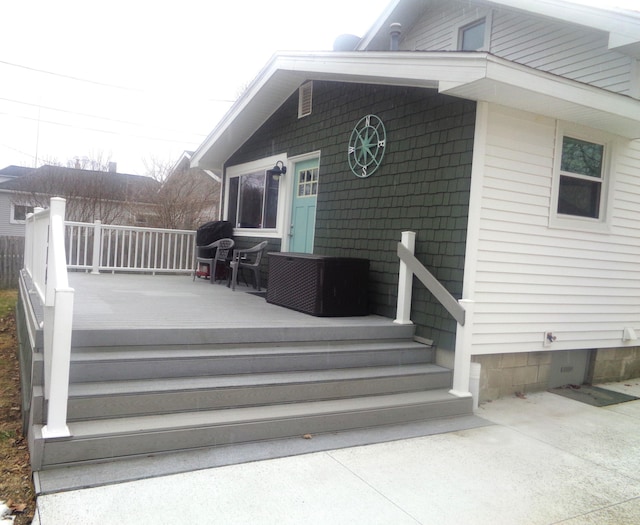 property entrance with a deck