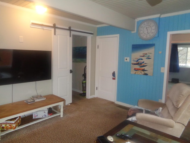 carpeted living room featuring a barn door and beamed ceiling