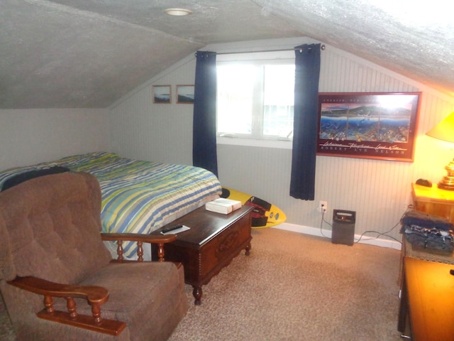 bedroom featuring a textured ceiling, carpet, and vaulted ceiling