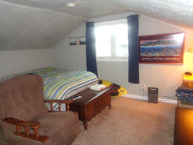 bedroom featuring lofted ceiling, carpet, and a textured ceiling